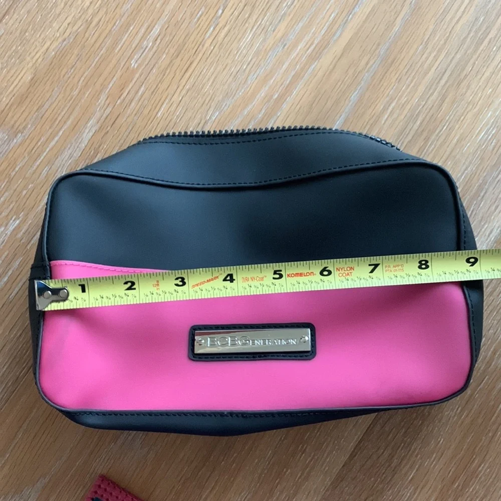 BCBGeneration plastic zippered cosmetic case pink black
